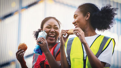 two women are laughing togehter
