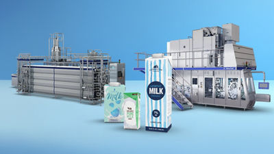 Tetra Brik Aseptic carton packages, heat exchanger and filling machine in backgroud