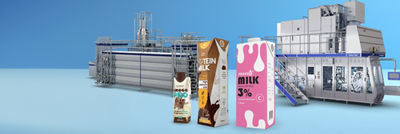 Aseptic cartons, heat exchanger and filling machine in background