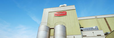 Dairygold production facility with two large stainless steel tanks outside