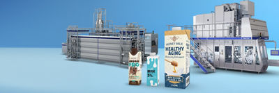 Aseptic cartons, heat exchanger and filling machine in background