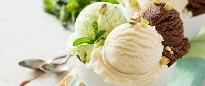 Vanilla, chocolate and pear ice cream in a bowl