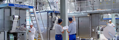 man showing equipment in plant