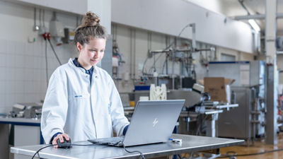 woman in front of an a computer in a ice cream pilot plant