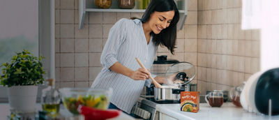 Woman cooking soup