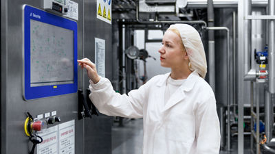 Woman operating machine