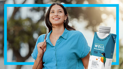 Woman, protein drink in Tetra Prisma Aseptic carton