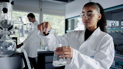 Tetra Pak employee preparing sample in lab, Stuttgart