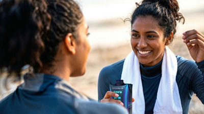 Sports women with protein drink in Tetra Prisma Aseptic carton