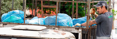 Worker in collection on a truck