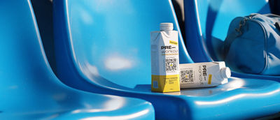 Sport drinks and sport bag on chairs