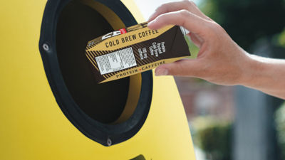Putting carton in recycling bin