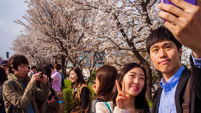 Youths in Asia taking selfie