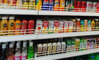 Zumi milkshakes on supermarket shelf.