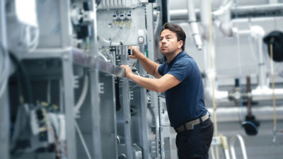 Man engineer working with machine