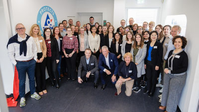 Group photo of smiling colleagues