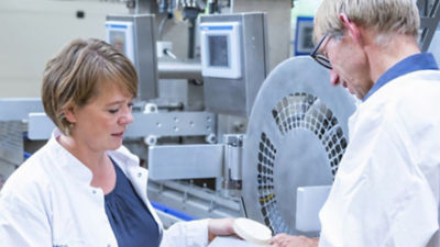 woman and man talking in a lab