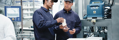 Staff examining carton package