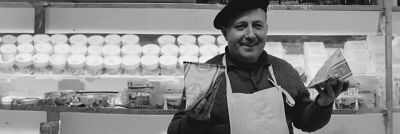 French gentleman holding two Tetra Pak packages