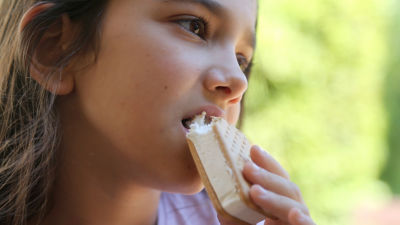 girl eating ice cream sandwich