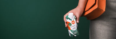 Woman holding a small carton 