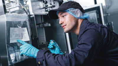 man fixing and reading machine
