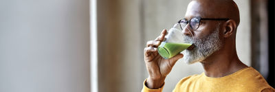 man drinking juice