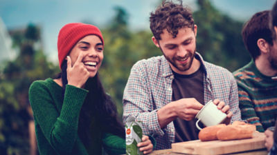 Friends eating outside with Tetra Pak carton package