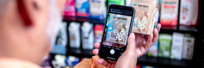 Man scanning QR code on a package