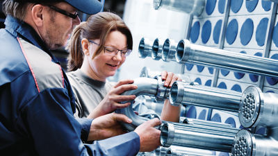 Employees with Tetra Pak Tubular Heat Exchanger