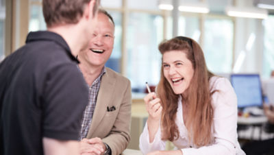 three people talking