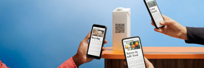 the phones scanning QR code on carton