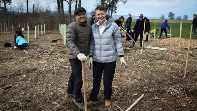 two employees out in nature working
