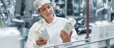 Woman in diary section in factory