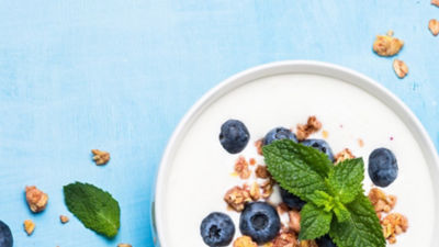 Yoghurt in bowl, granola and berries