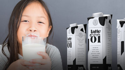 girl drinking milk from carton