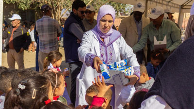 Woman and children in Moroccos school feeding programme