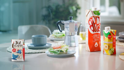 Breakfast table with beverage carton and coffee