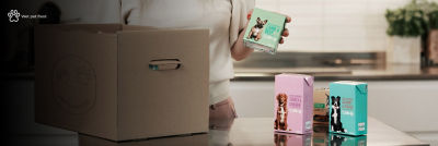 Cardboard box and pet food in Tetra Recart carton packages