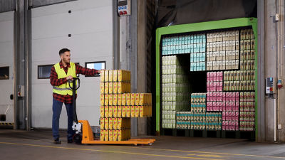 man packing cartons into storage 
