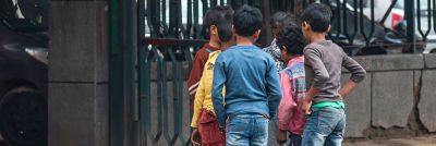 Children with back turned against camera