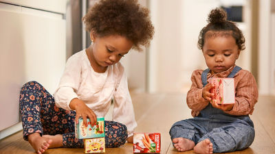 Children playing with Tetra Recart packages