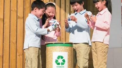 children handling cartons 