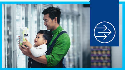 Chinses man with baby shopping milk 