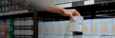Choosing chick peas in Tetra Recart carton packages
