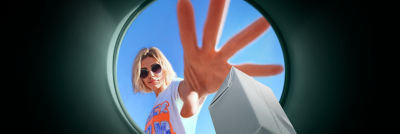 Girl putting carton in recycling bin
