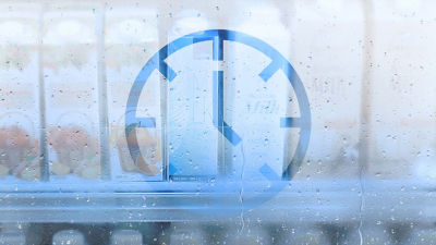 Clock icon, cartons behind misty glass window