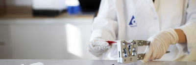 A person compressing a carton
