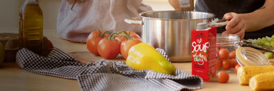 Cooking soup, soup in Tetra Brik Aseptic carton and fresh vegetables
