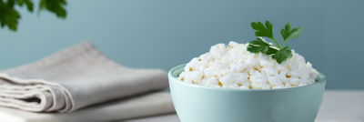 Cottage cheese and herbs in bowl